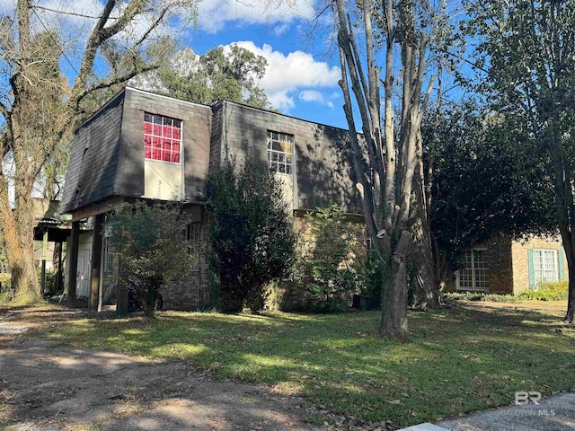 view of home's exterior featuring a lawn