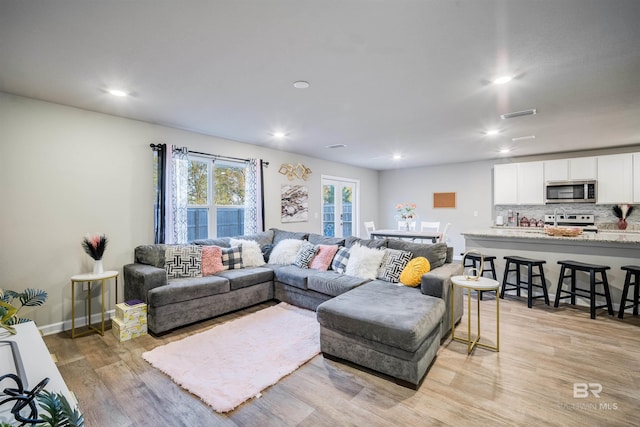 living room featuring light hardwood / wood-style floors