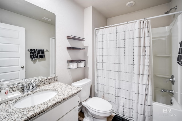 full bathroom with shower / tub combo with curtain, vanity, and toilet