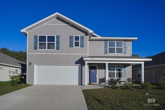 view of front of house with a garage and a front yard