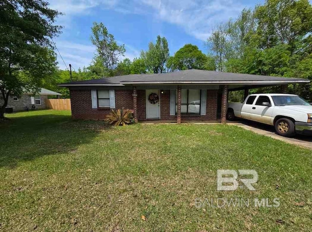 view of front of home with an attached carport, brick siding, and driveway