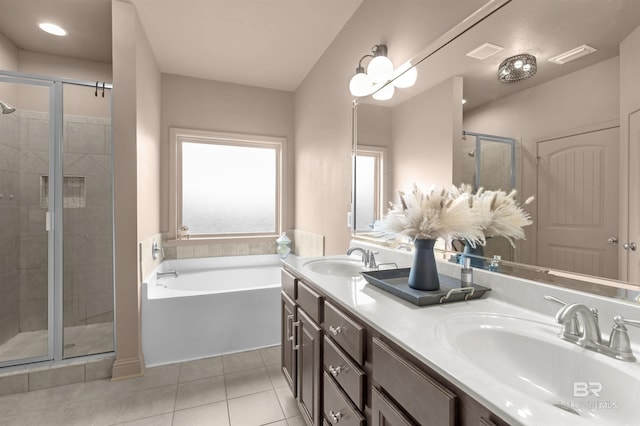 bathroom featuring tile patterned flooring, vanity, and separate shower and tub