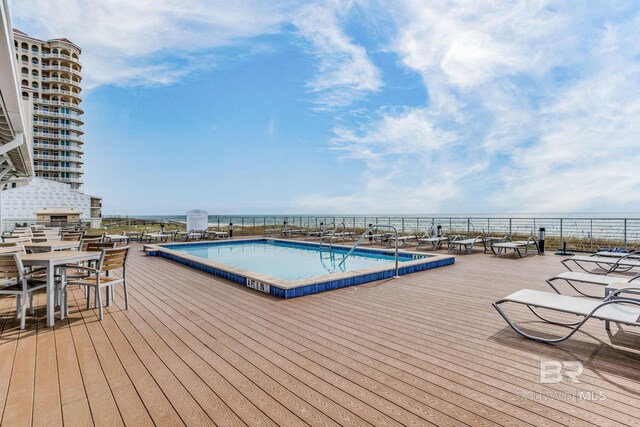 exterior space with a community pool and an outdoor living space