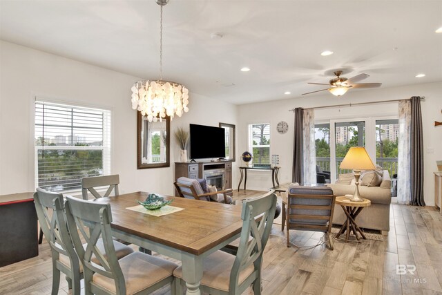 dining area with plenty of natural light, light hardwood / wood-style flooring, and ceiling fan