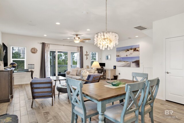 living room with light wood-type flooring and ceiling fan