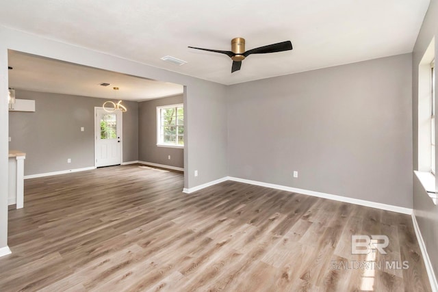 spare room featuring ceiling fan and hardwood / wood-style floors