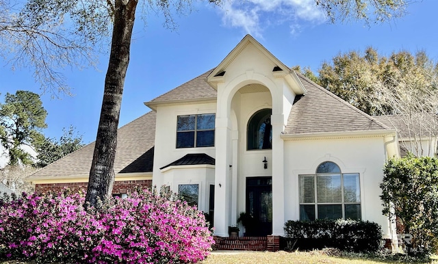 30139 Dolive Rdg, Daphne, AL 36527 - french country inspired facade with roof with shingles and stucco siding