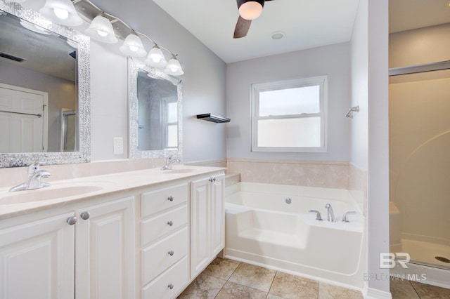26715 Terry Cove Dr, Orange Beach, AL 36561 - full bath featuring a garden tub, double vanity, a stall shower, ceiling fan, and tile patterned floors