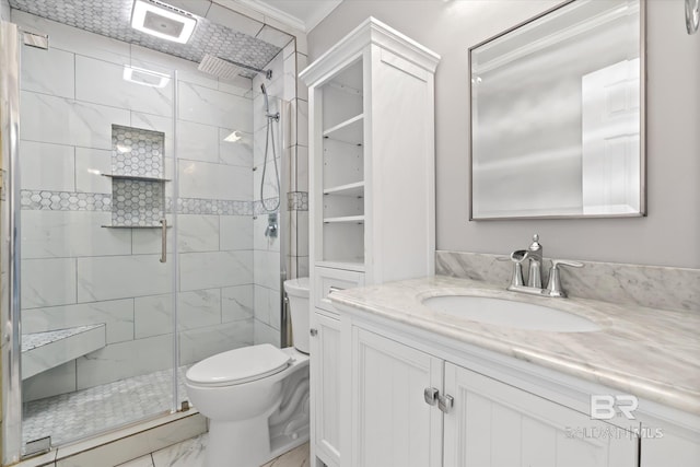 26715 Terry Cove Dr, Orange Beach, AL 36561 - bathroom with marble finish flooring, toilet, a shower stall, vanity, and crown molding