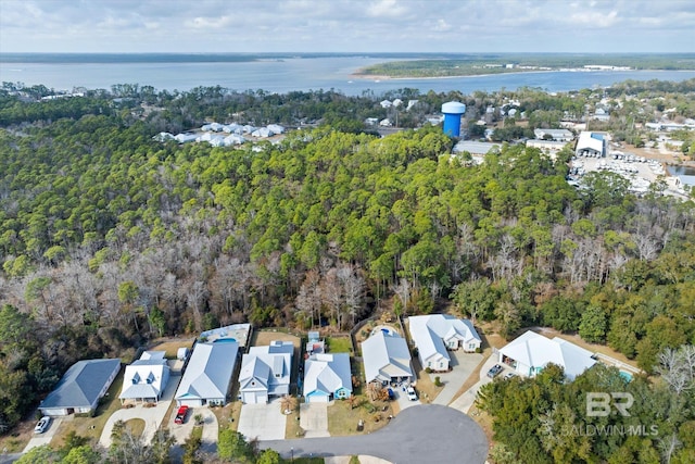 26715 Terry Cove Dr, Orange Beach, AL 36561 - aerial overview of property's location with nearby suburban area, a heavily wooded area, and a large body of water