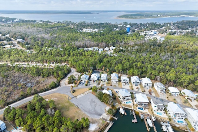 26715 Terry Cove Dr, Orange Beach, AL 36561 - aerial view of property's location with a large body of water, nearby suburban area, and a heavily wooded area