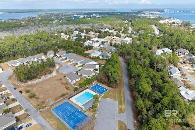 26715 Terry Cove Dr, Orange Beach, AL 36561 - aerial view of property and surrounding area featuring a large body of water, a pool area, and nearby suburban area