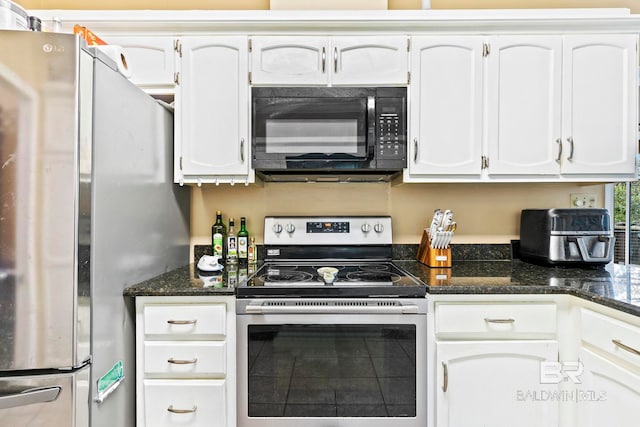 kitchen with white cabinets, dark stone countertops, and appliances with stainless steel finishes