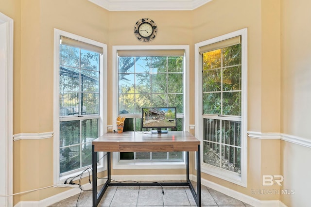 interior space featuring light tile patterned floors, ornamental molding, and a healthy amount of sunlight