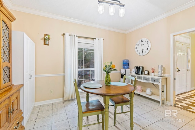 dining space with light tile patterned flooring and crown molding