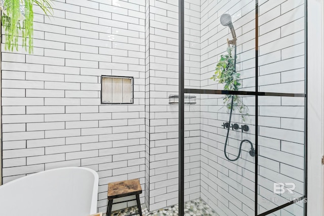 bathroom featuring separate shower and tub