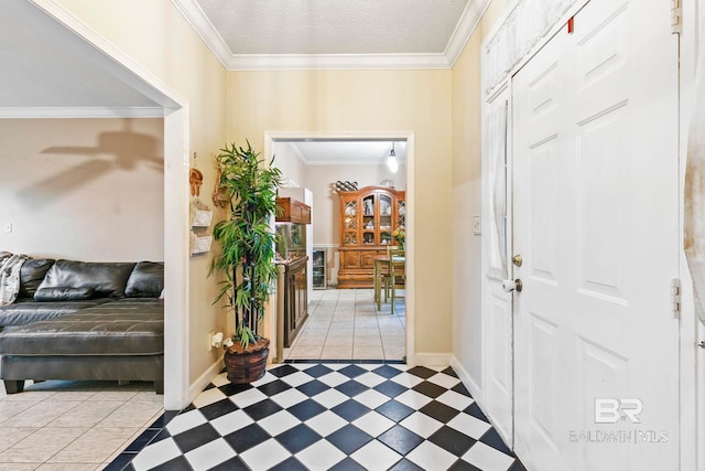 entrance foyer featuring a textured ceiling and ornamental molding