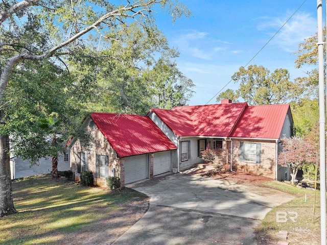 view of front of property featuring a garage and a front yard