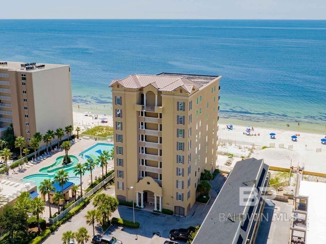 birds eye view of property featuring a water view and a view of the beach