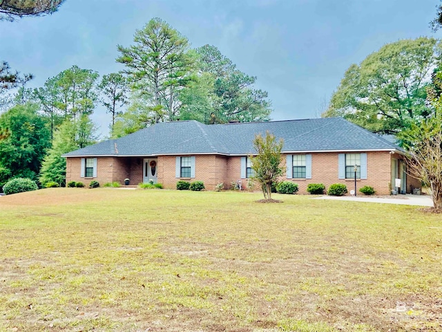 ranch-style house with a front lawn