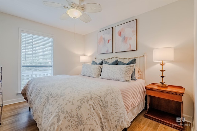 bedroom featuring hardwood / wood-style flooring and ceiling fan