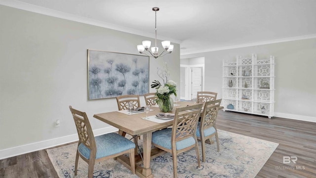 11529 Thistledown Loop, Spanish Fort, AL 36527 - dining room featuring baseboards, ornamental molding, a chandelier, and wood finished floors