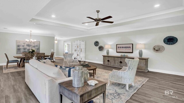 11529 Thistledown Loop, Spanish Fort, AL 36527 - living area featuring baseboards, ceiling fan, a raised ceiling, a chandelier, and ornamental molding