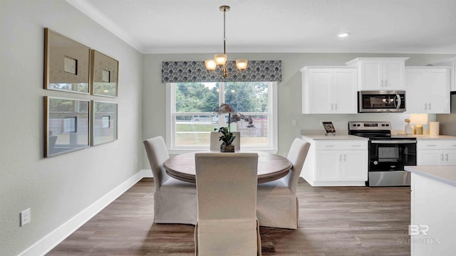 11529 Thistledown Loop, Spanish Fort, AL 36527 - dining room featuring a chandelier, baseboards, dark wood-type flooring, and recessed lighting