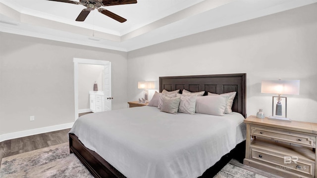 11529 Thistledown Loop, Spanish Fort, AL 36527 - bedroom featuring wood finished floors, a raised ceiling, baseboards, ceiling fan, and ensuite bathroom