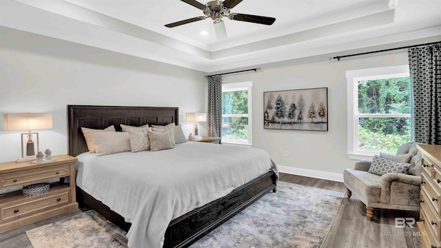 11529 Thistledown Loop, Spanish Fort, AL 36527 - bedroom with a tray ceiling, wood finished floors, baseboards, ceiling fan, and recessed lighting