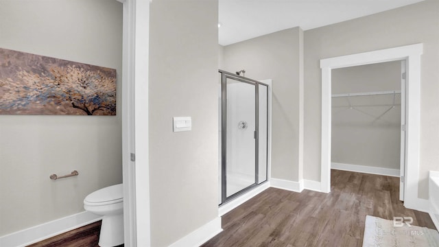 11529 Thistledown Loop, Spanish Fort, AL 36527 - full bath with a shower stall, wood finished floors, a walk in closet, toilet, and baseboards