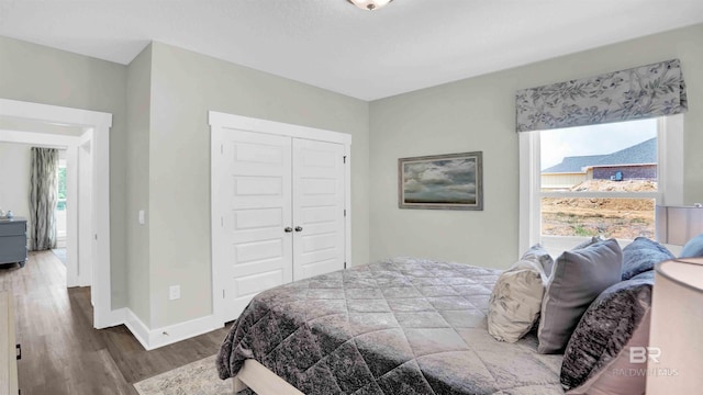11529 Thistledown Loop, Spanish Fort, AL 36527 - bedroom with wood finished floors, a closet, and baseboards