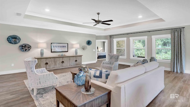11529 Thistledown Loop, Spanish Fort, AL 36527 - living room with a tray ceiling, ceiling fan, wood finished floors, baseboards, and recessed lighting