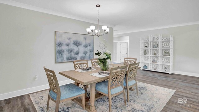 11529 Thistledown Loop, Spanish Fort, AL 36527 - dining room with ornamental molding, baseboards, a chandelier, and wood finished floors