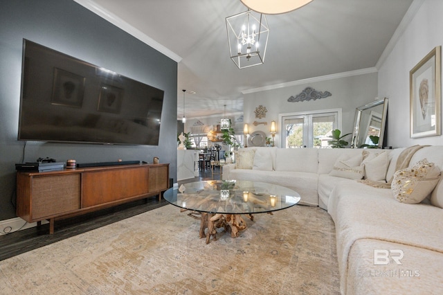 living area featuring french doors, ornamental molding, wood finished floors, and an inviting chandelier