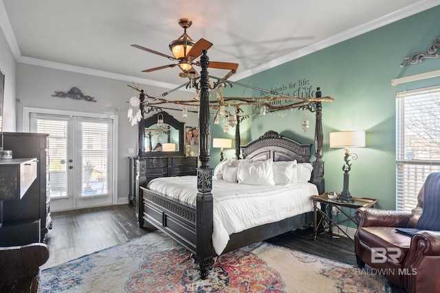 bedroom featuring multiple windows, crown molding, and wood finished floors