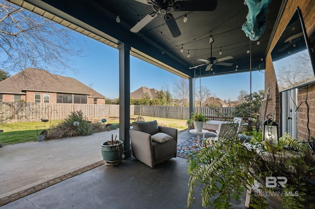 view of patio with a fenced backyard, ceiling fan, and an outdoor living space