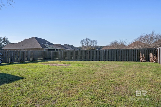 view of yard with a fenced backyard