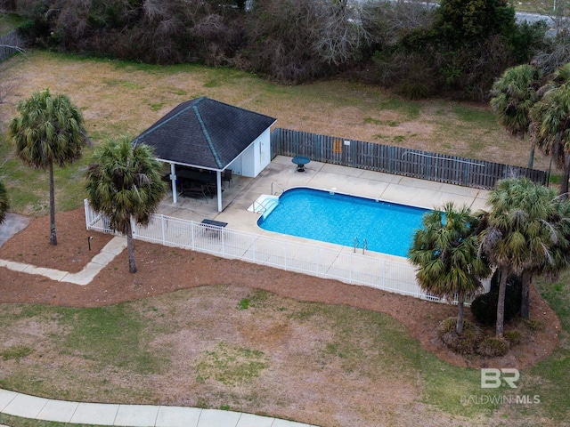 view of pool with a fenced in pool, a patio, and fence