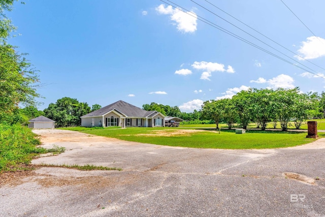 ranch-style home with a garage and a front yard