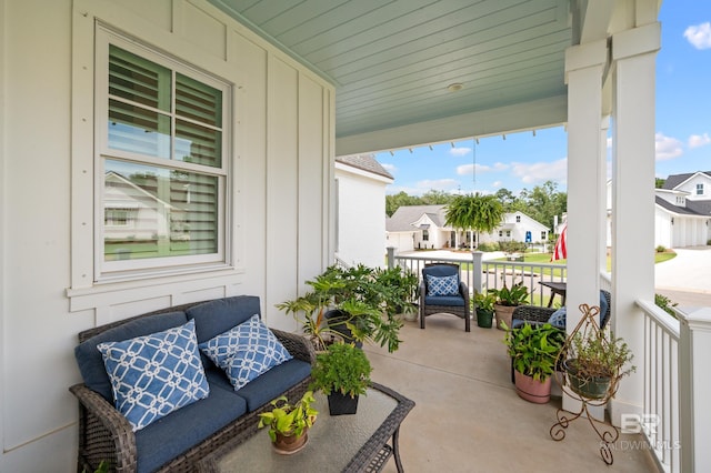 balcony featuring a residential view and covered porch