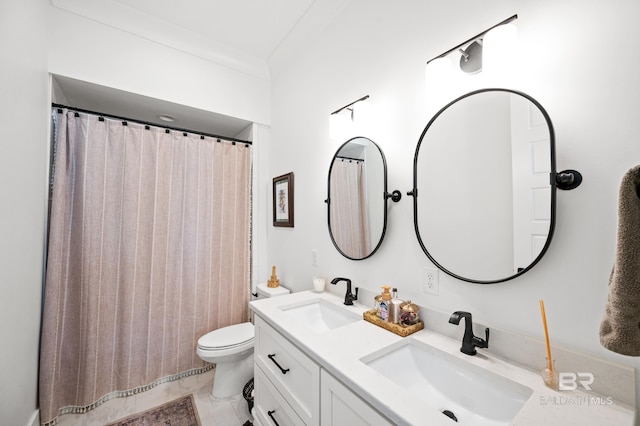 bathroom with tile patterned floors, double sink vanity, toilet, and ornamental molding