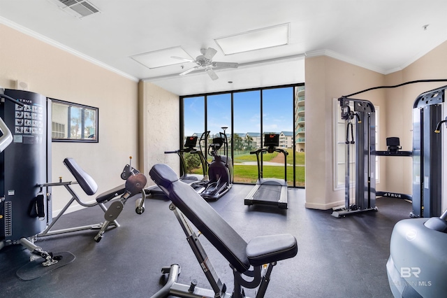 gym featuring a ceiling fan, attic access, baseboards, visible vents, and ornamental molding