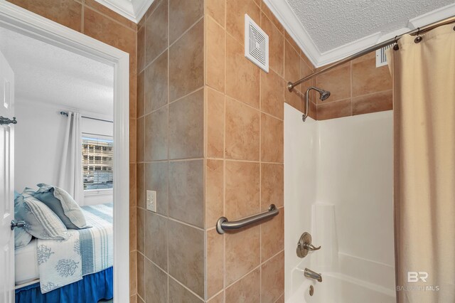full bathroom with shower / bathtub combination with curtain, crown molding, a textured ceiling, ensuite bath, and visible vents