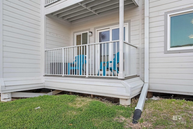wooden terrace with a lawn