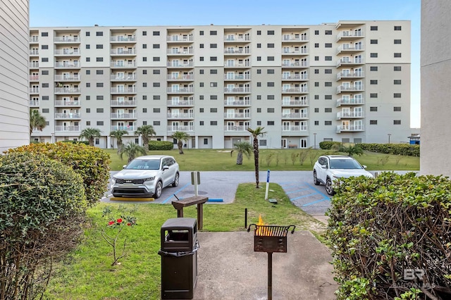 view of property's community with a lawn