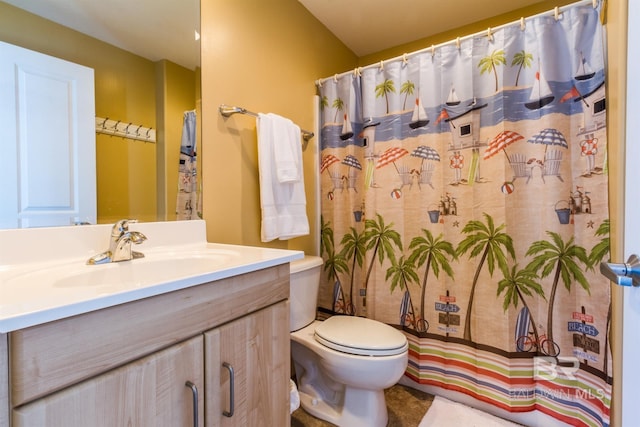 bathroom with vanity and toilet