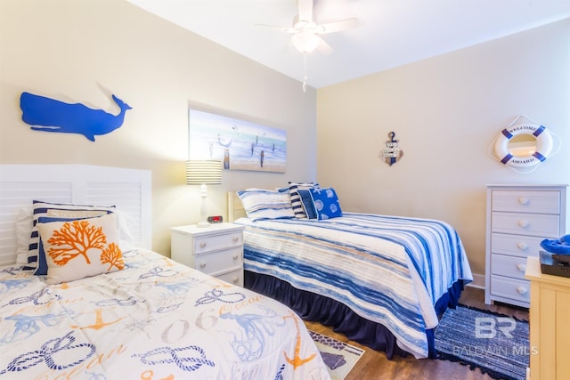 bedroom featuring dark hardwood / wood-style flooring and ceiling fan