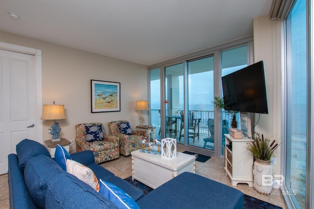 living room featuring floor to ceiling windows