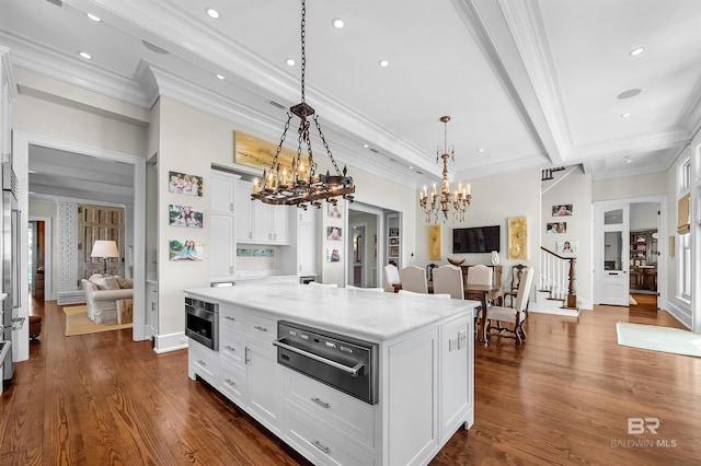 kitchen with a warming drawer, dark wood-style floors, white cabinetry, and built in microwave